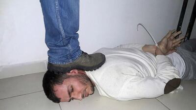 An unidentified man is arrested during a raid in the Esenyurt district of Istanbul, in which a 34-year-old Uzbek man suspected of mowing down 39 people at an Istanbul nightclub on New Year’s Eve was also arrested. One Iraqi man and three women were also captured and detained in the raid. AFP Photo / DEPO photos / Turkish Police