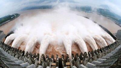 A picture shows this year's biggest release of water from the sluice for flood prevention at the Three Gorges Dam in Yichang, central China's Hubei province, on July 20, after relentless torrential rains hit Yangtze River areas. The massive water flow on the Yangtze was expected to pose the biggest test for the Three Gorges Dam -- the world's largest hydroelectric project -- since it was completed in 2006, as rivers throughout rain-hit regions have risen to or beyond their warning levels, flooding numerous towns and cities.