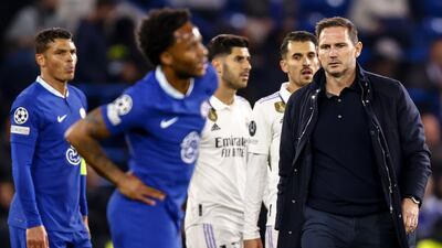 Chelsea's head coach Frank Lampard, right, walks on the pitch following a 2-0 defeat to Real Madrid in the Champions League. EPA