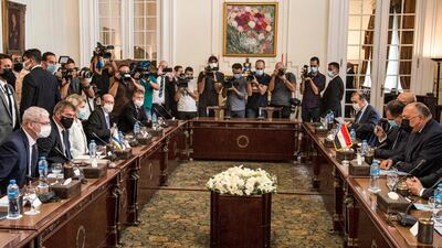 Egypt's Foreign Minister Sameh Shoukry, right, meets with Israel's Foreign Minister Gabi Ashkenazi, second left, and his accompanying delegation, at Tahrir Palace in Cairo, on Sunday. AFP