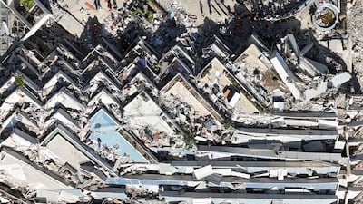 A collapsed building is a monument to the twin earthquakes that shook La Guaira state in Venezuela, as rescuers scour debris for survivors. AFP