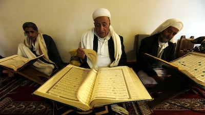 Yemenis read the Quran at a mosque in Sanaa. EPA