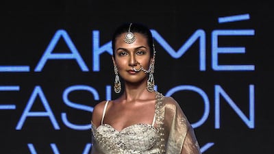 Designer Anita Dongre employs a cream and metallic palette in her creations for spring/summer 2019 at Lakme Fashion Week. EPA