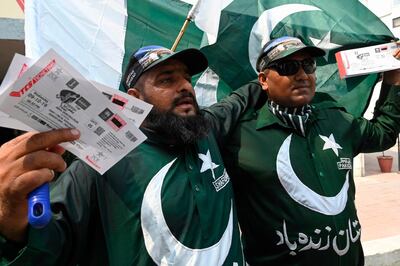 Pakistani cricket fans display tickets for the upcoming cricket match between Pakistan and Sri Lanka in Lahore on September 21, 2019. AFP