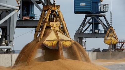 A crane loads wheat grain onto a cargo vessel, in the occpupied Ukrainian port of Mariupol, before its departure for the Russian city of Rostov-on-Don. Reuters
