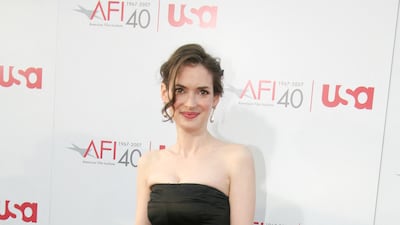 Winona Ryder arrives at the 35th AFI Life Achievement Award tribute to Al Pacino in an A-line, strapless black dress at the Kodak Theatre on June 7, 2007 in Hollywood, California. AFP