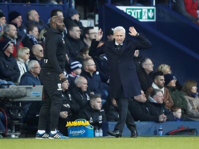 West Brom have a caretaker manager in Darren Moore, left, following the exit of Alan Pardew, right. Carl Recine / Reuters
