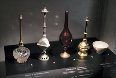 Ornate perfume bottles and traditional medkhans are on display. Reem Mohammed / The National