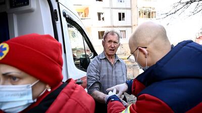 Emergency staff treat an injured man after bombing in Chuguiv. AFP