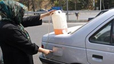 The Iranian leadership introduced petrol rationing after major oil traders withdrew from the country.