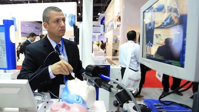 Rabih Dandachi from Medtronic demonstrates Fusion, a surgical navigation system by Medtronic at the Arab Health Congress. The medical giant is planning to move its regional headquarters to Dubai. Sarah Dea/The National