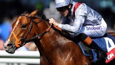 Richard Hughes rides Olympic Glory to victory in the Greenham Stakes at Newbury racecourse.