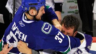 Rick Rypien, left, had suffered with depression before he was found dead at his home in Alberta last month. Scientists are researching a link between the deaths of several of the NHL's enforcers and a degenerative brain disease called chronic traumatic encephalopathy as a result of damage caused by fighting.
