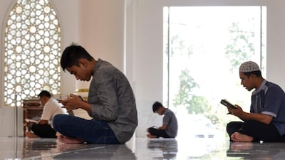 Indonesian Muslims read the Koran during the Islamic holy month of Ramadan at a mosque in Banda Aceh, Indonesia's Aceh province. AFP