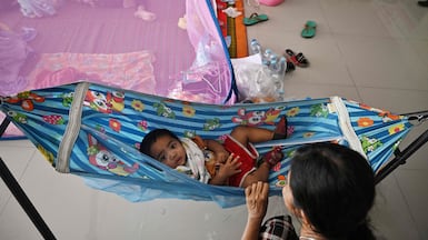 Displaced residents rest at an evacuation centre in the Thai border province of Surin. AFP