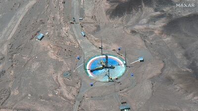 A satellite image shows a rocket about to be attached to a launch tower at Imam Khomeini Space Centre near Semnan, Iran, on Tuesday. Maxar Technologies via AP