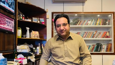 Fayaz Zafar, a journalist who has covered the Taliban insurgency in Swat, poses for a picture in his office in Mingora.