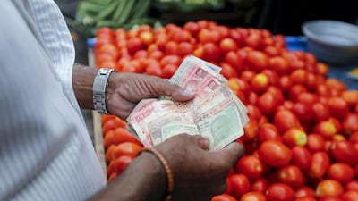 A vegetable trader in Mumbai. Many Muslims in India reluctantly use the conventional banking system and others avoid using banks altogether. Shailesh Andrade / Reuters