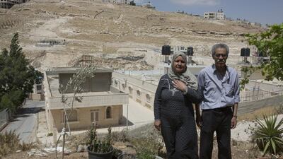 Mahmoud Al Mahdi, 73, and his wife Oafish Al Maghreb, 56, outside their home on a rocky hillside in Abu Dis, a Jerusalem suburb separated from the holy city by Israel’s concrete security barrier. Mr Al Mahdi was at university in Iraq on June 10, 1967 - the day that Israel destroyed the neighbourhood where he grew up in. Heidi Levine for The National