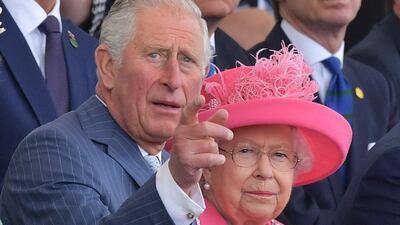 (L-R) Britain's Prince Charles, Prince of Wales, gestures as he speaks to Britain's Queen Elizabeth II (R) in the royal box during an event to commemorate the 75th anniversary of the D-Day landings, in Portsmouth, southern England. AFP