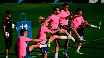 Atletico Madrid players take part in training ahead of the Uefa Champions League match against Chelsea. Pierre-Philippe Marcou / AFP