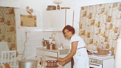 Maria Piedade Bertha bakes a cake for her middle child's 15th birthday. Piedade Bertha, school teacher from Mumbai, travelled by ship to join her husband Lawrence Richard Sequeira in the Gulf and brought along a four-poster bed gifted to them for their wedding. Courtesy: Sheena Dabholkar