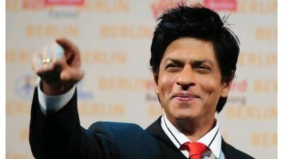 After his action movie's premiere, Shah Rukh Khan will be holding the hammer at charity auction for the Rashid Paediatric Therapy Centre. Johannes Eisele / AFP