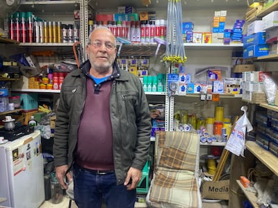 Jean Suleiman Hanna runs a hardware shop opposite a church that was damaged in a drone attack earlier this month. Lizzie Porter / The National