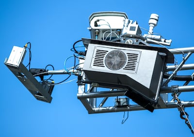 The unmanned system sits on a 5-metre pole above the road. Victor Besa / The National.