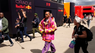 Hamilton walks through the paddock ahead of the British Grand Prix. AP
