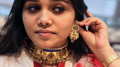 Mesmerising jewellery, delicious sweets and chic dresses add sparkle to Diwali celebrations. Divyakant Solanki / EPA