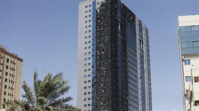 The charred exterior of the Abdul Naser building in King Faisal Road in Sharjah. Sarah Dea / The National