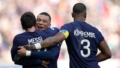 Lionel Messi, left, celebrates with his teammates Kylian Mbappe and Presnel Kimpembe after scoring. AP