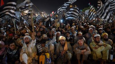 Supporters wave party flags. AFP