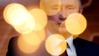 Russian President Vladimir Putin reacts during his annual end-of-year news conference in Moscow. Reuters