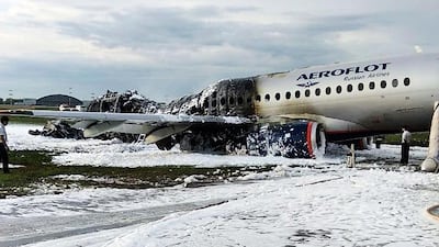The Sukhoi Superjet 100 aircraft of Aeroflot Airlines covered in fire retardant foam. AP