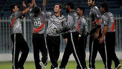 Rohan Mustafa, centre, took three wickets as Namibia capitulated against UAE at Sharjah Cricket Stadium. Satish Kumar / The National