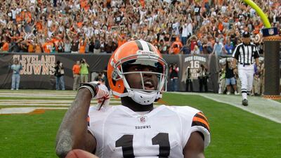 Cleveland Browns wide receiver Mohamed Massaquoi flips the ball away after a 14-yard touchdown catch against the Miami Dolphins in the final minute of an NFL football game Sunday, Sept. 25, 2011, in Cleveland. The Browns won 17-16. Mark Duncan / AP Photo