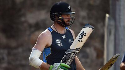 New Zealand's Martin Guptill checks his bats in nets during a training session on the eve of the first World T20 cricket tournament semi-final match between England and New Zealand at the Feroz Shah Kotla cricket ground in New Delhi on March 29, 2016. / AFP / PRAKASH SINGH