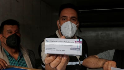 A man shows a box containing doses of the AstraZeneca coronavirus vaccine at Baghdad International Airport in Iraq. Reuters