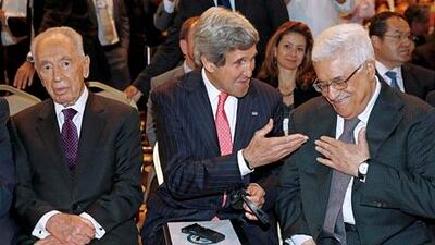 John Kerry, centre, says the Palestinian economy would benefit immensely from the $4 billion investment plan. Jim Young / AP Photo