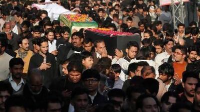Pakistani Shiite Muslims mourn the victims of a Taliban suicide bombing, which struck a procession in Rawalpindi, near Islamabad. Twenty-three people were killed.