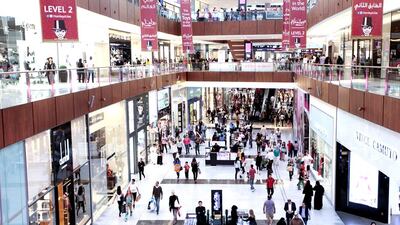 Shoppers swarm the Dubai Mall. The retail sector, which accounts for more than a quarter of all economic activity in the city, grew at 4.1 per cent as Dubai attracted a record number of tourists in the first half of the year. Sarah Dea / The National