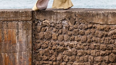 At Stephane Rolland, an antiqued gold tunic was fronted with beading of amber, red coral and citrin for haute couture autumn / winter 2021.