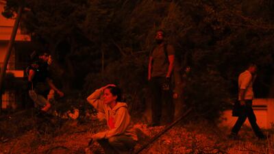 Residents are distraught after being evacuated from their homes in Penteli, Greece, as wildfire rages. EPA
