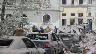 Ukrainian rescuers search for victims after a Russian missile attack destroyed an apartment block in Lviv. EPA