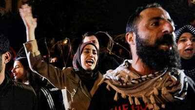 Lebanese protesters chant slogans as they gather near the home former prime minister Saad Hariri in central Beirut after parliamentary consultations to nominate a new premier were postponed. AFP