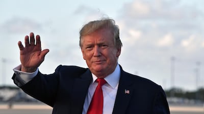 US President Donald Trump waves upon arrival at Palm Beach International airport, Florida on April 18, 2019. AFP