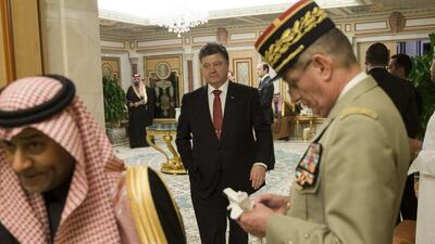 The president of Ukraine, Petro Poroshenko, centre, arrives at a ceremony at the Diwan royal palace in Riyadh to offer his condolences to Saudi Arabia’s King Salman on January 24, 2015. Yoan Valat/ AP Photo