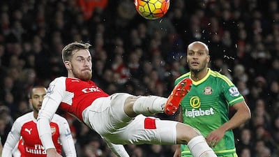 Arsenal’s Welsh midfielder Aaron Ramsey attempts a shot on goal during the English Premier League football match between Arsenal and Sunderland at the Emirates Stadium in London on December 5, 2015. AFP PHOTO
